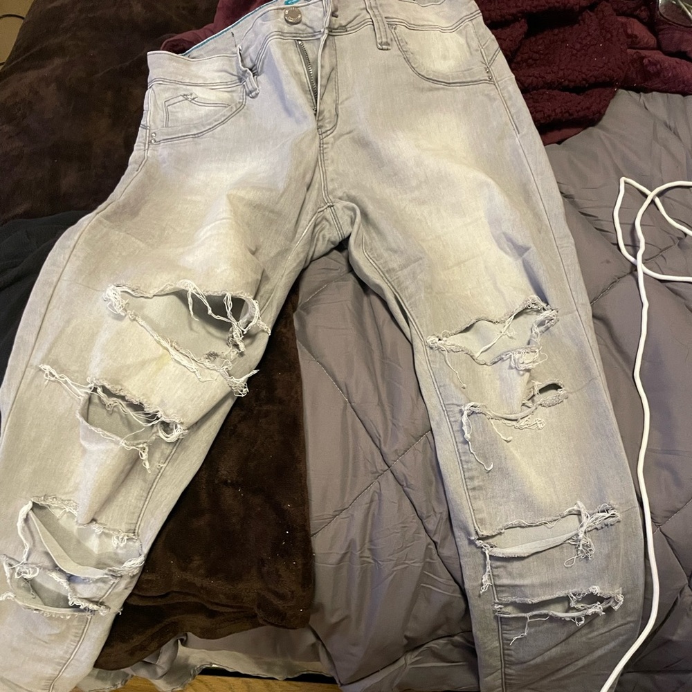 Size 13 grey stretch jeans with rips in legs(designed by wanna a butt.No defects